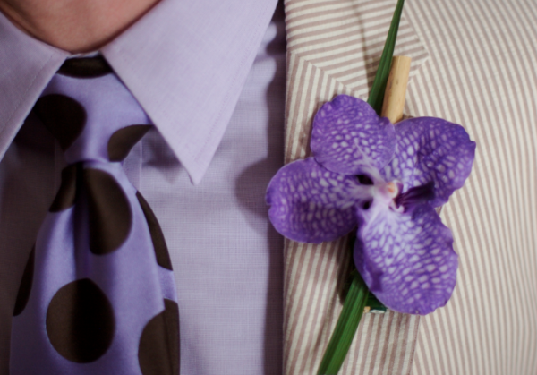 Purple vanda orchid with lily grass and dried bamboo