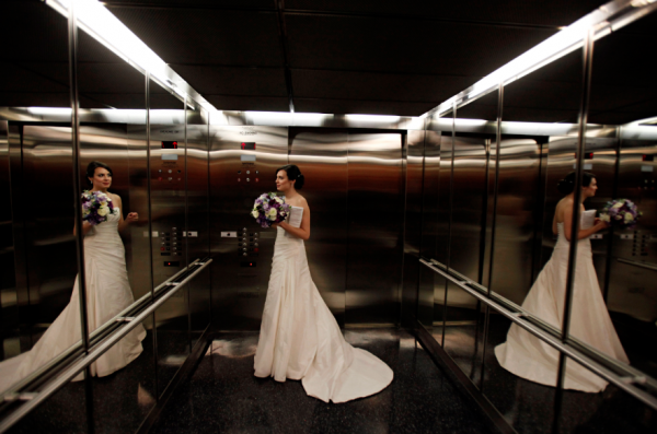 Newseum Elevator in Washington with bride and flowers by Elegance and Simplicity