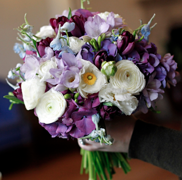 Bridal bouquet by Elegance and Simplicity with hydrangea, ranunculus, delphinium, freesia and tulips