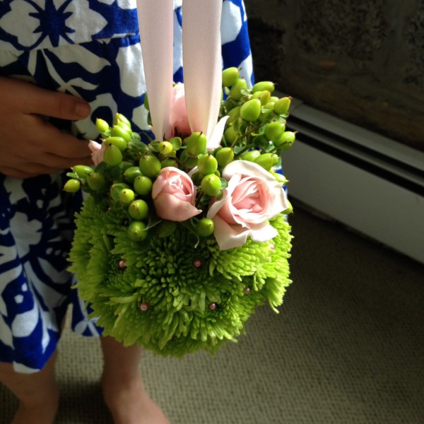 Flower girl before ceremony in Bethesda, Maryland with her pomander