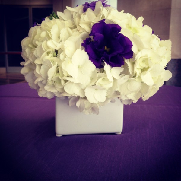 White and purple cocktail hour arrangements at the Ronald Reagan Building