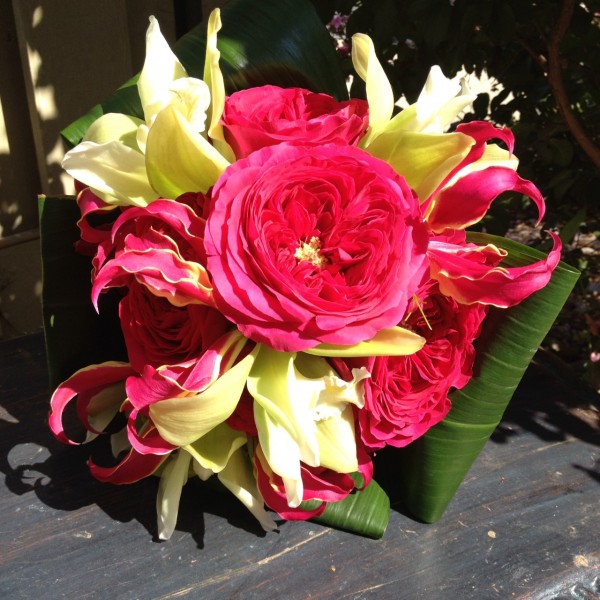 Bridesmaids bouquets with orchids, roses and gloriosa lilies 