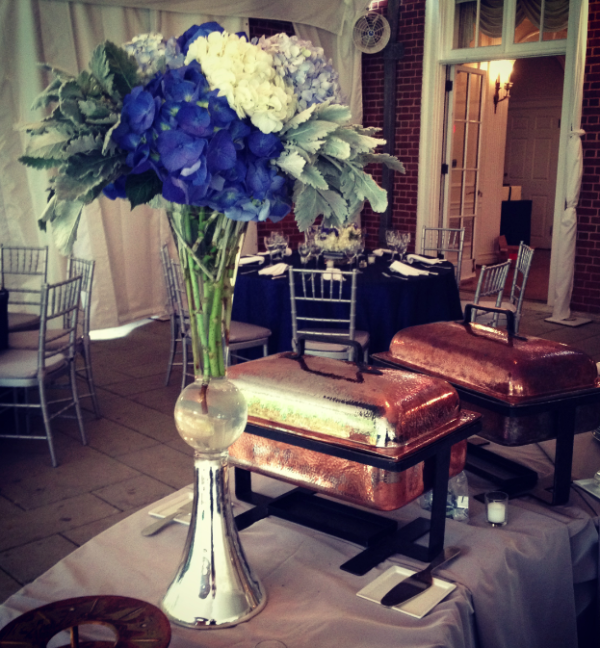 Woodend Wedding with blue hydrangea and white and gray accent buffet arrangement